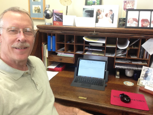 Bruce at his desk at Wycliffe Associates